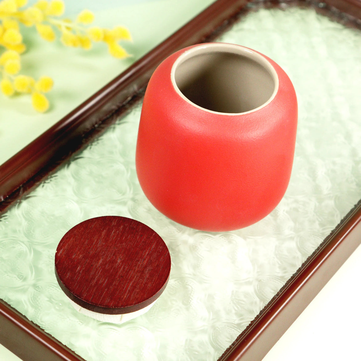 Aurora coral ceramic jar with wooden lid on decorative tray