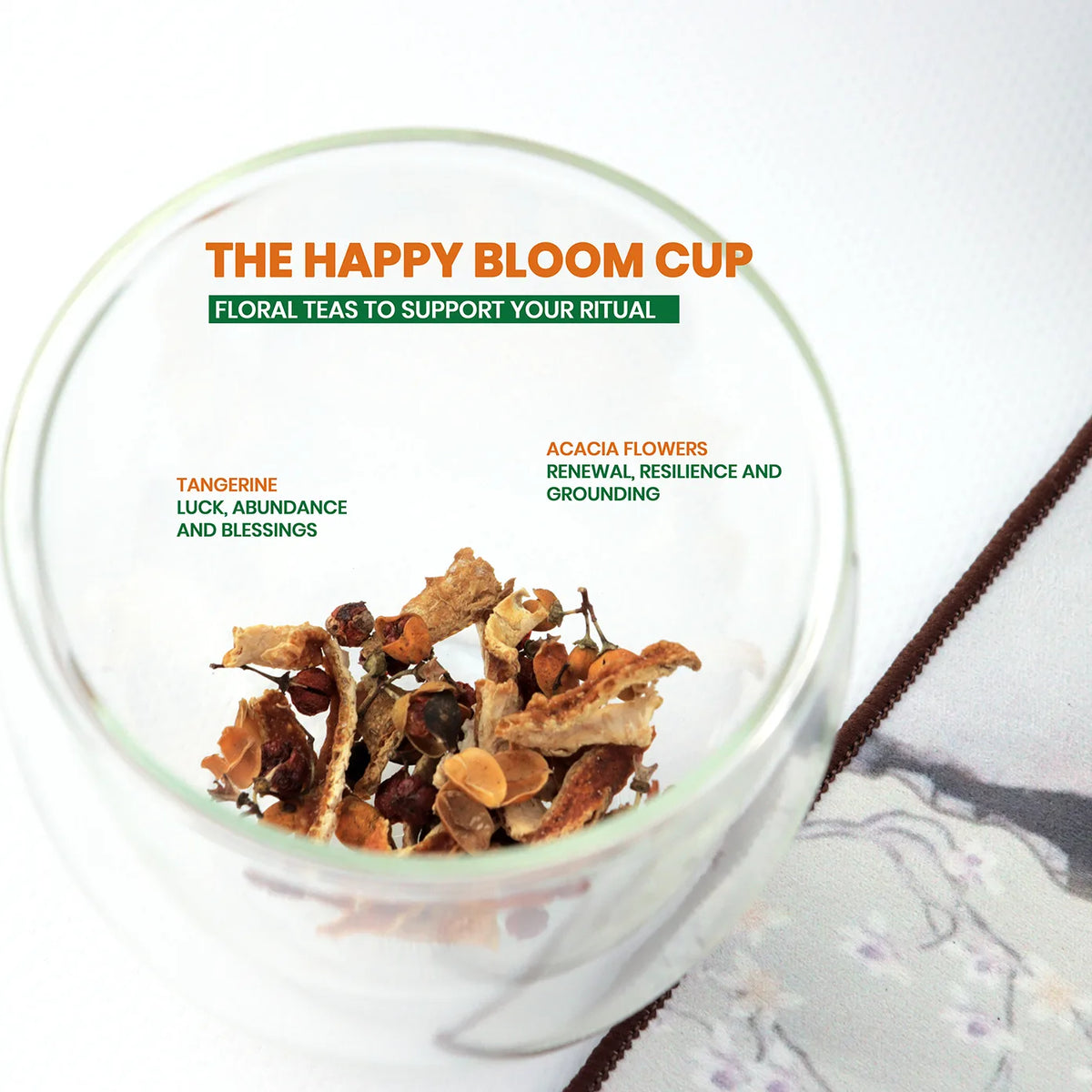 Happy Bloom Cup floral tea blend with tangerine and acacia flowers in glass cup