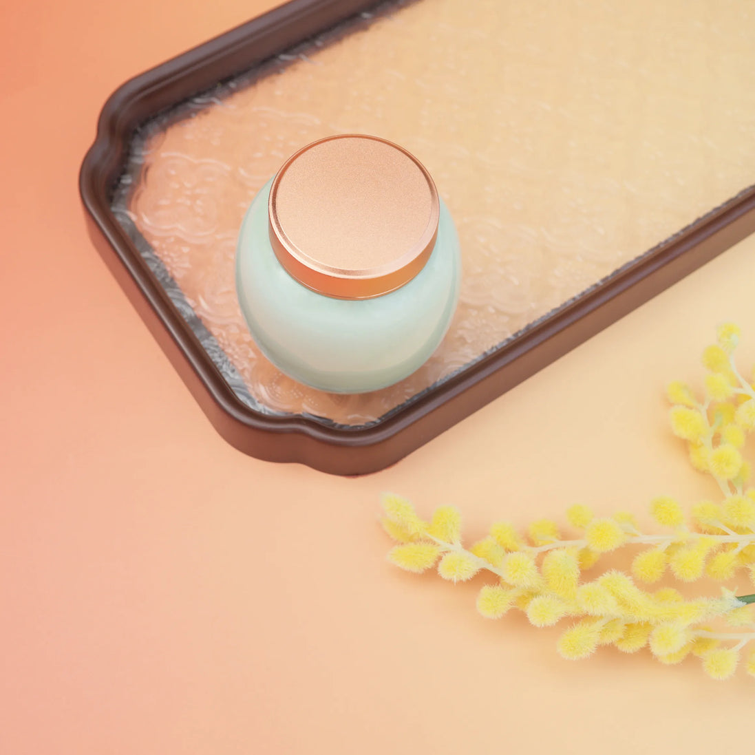 Lily jar mint green cosmetic container with rose gold lid on ceramic tray