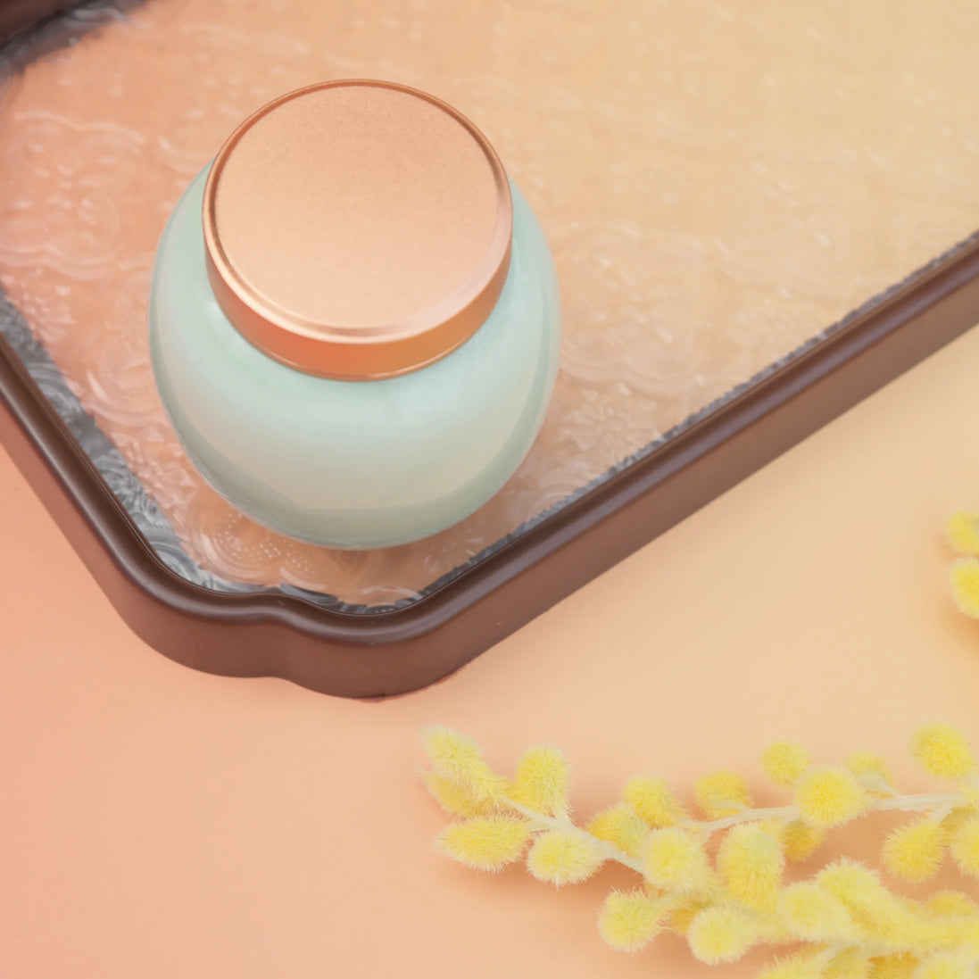 Lily jar in mint green with rose gold lid on terracotta packing cube