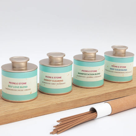 Peoni & Stone aromatherapy incense blends in teal tins with bamboo holder and natural incense sticks