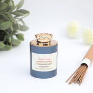 Energy clearing incense blend with agarwood, mint and rosemary in slate blue jar with gold crystal lid