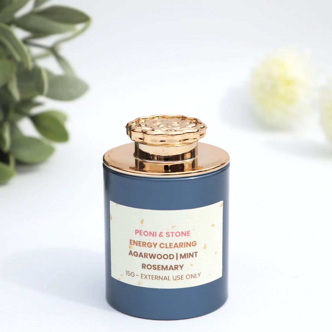 Peoni & Stone energy clearing incense blend with agarwood, mint and rosemary in navy jar with rose gold lid