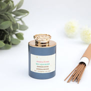 Self Love Blend incense with ginger rose sandalwood in navy jar with gold lid and incense sticks
