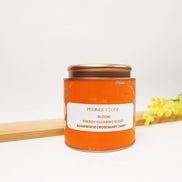 Dried rosemary needles in decorative pink floral bowl, golden brown herbs for energy clearing and spiritual rituals