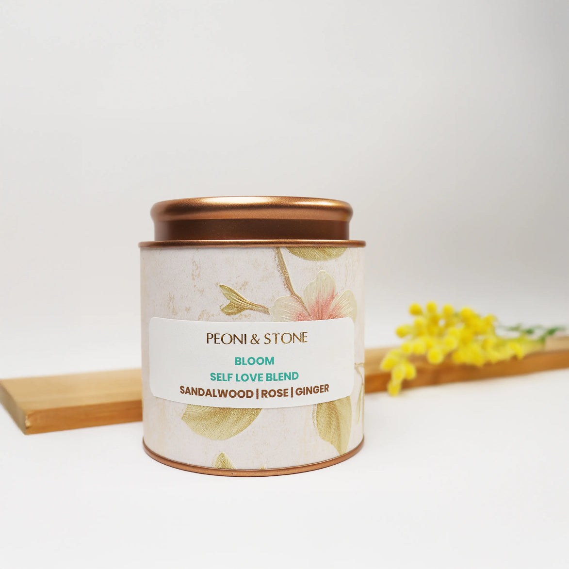 Peoni & Stone decorative tin with copper lid, floral pattern, containing Bloom Self Love Blend of sandalwood, rose and ginger