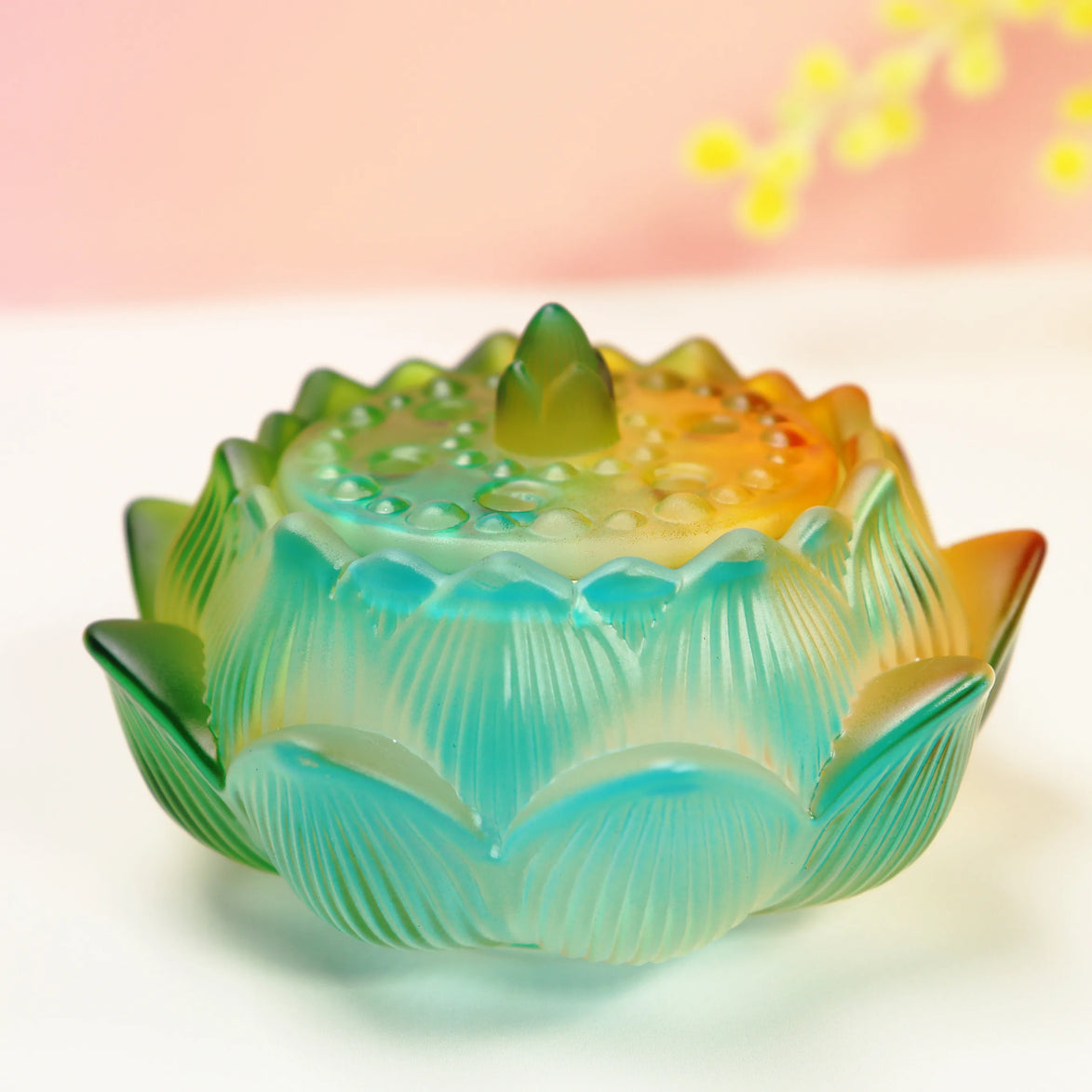 Turquoise to orange ombre glass lotus flower burner with detailed petals and textured center bowl