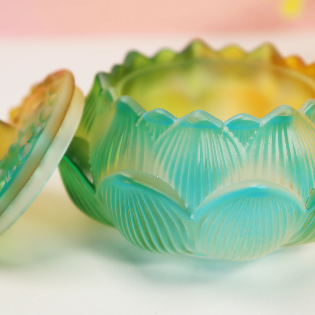 Turquoise and yellow ombre glass lotus burner with scalloped petal edges and ribbed texture detailing