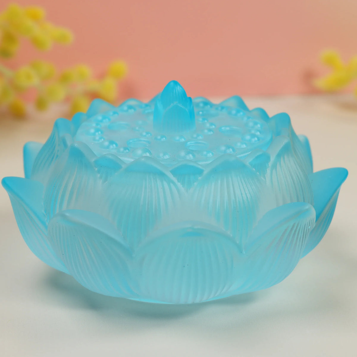 Frosted turquoise glass lotus flower incense burner with carved petals and textured sealing lid