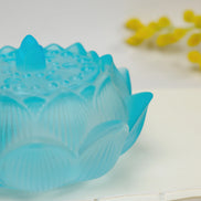 Translucent blue glass lotus flower incense burner with detailed petal engravings and sealing lid