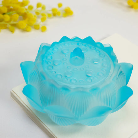 Translucent dawn blue glass lotus flower incense burner with embossed petals and decorative patterns