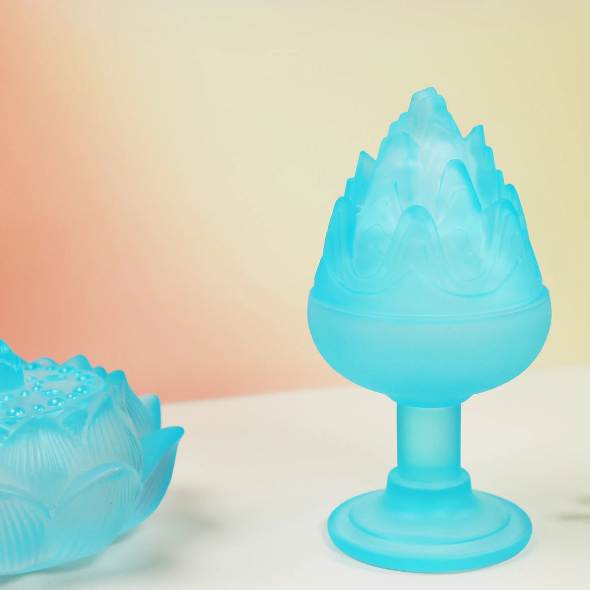 Translucent blue glass Boshan incense burner with flame-shaped peak on pedestal base