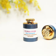 Natural beige incense powder in ceramic bowls on wooden surface, showing fine texture and earthy tones