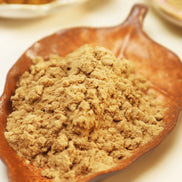 Blue and white glass bottle of Peoni & Stone Energy Clearing incense with gold decorative cap and yellow flowers above