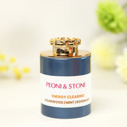 White incense bottle with gold cap featuring Peoni & Stone Energy Clearing blend with agarwood, mint, and rosemary