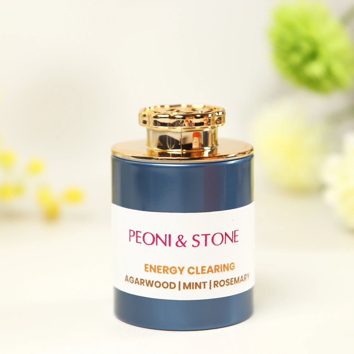White incense bottle with gold cap featuring Peoni & Stone Energy Clearing blend with agarwood, mint, and rosemary