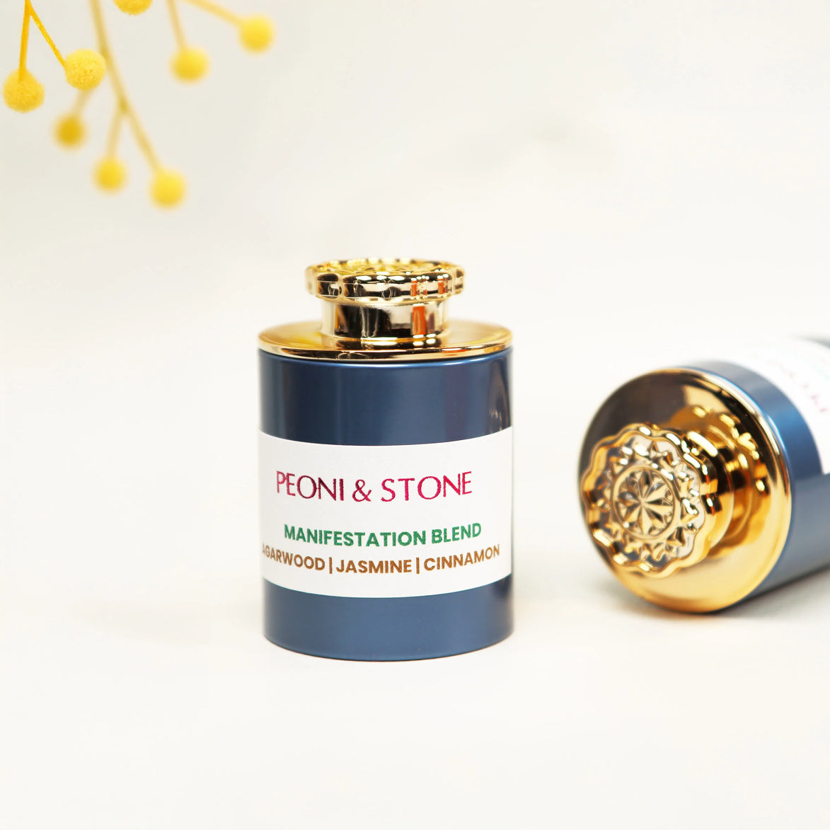 Golden brown manifestation incense powder displayed in a wooden leaf-shaped bowl with additional bowls in background