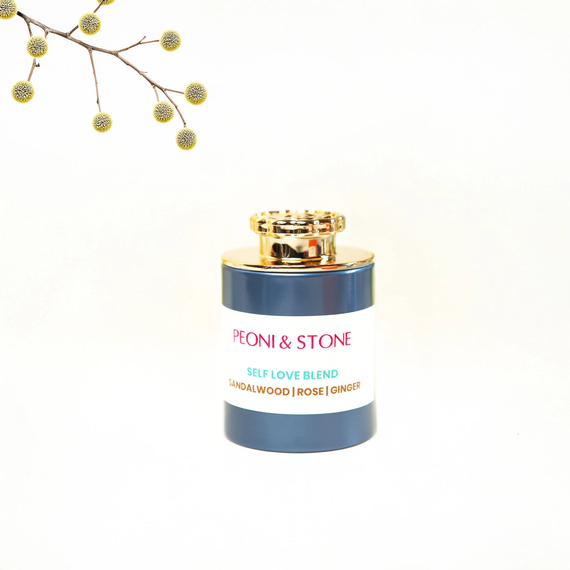 Navy and gold incense vessel labeled Peoni & Stone Self Love Blend with sandalwood, rose, and ginger
