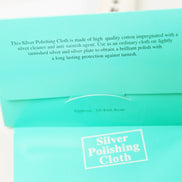 Mint green Peoni & Stone silver polishing cloth package with product information and white text labeling