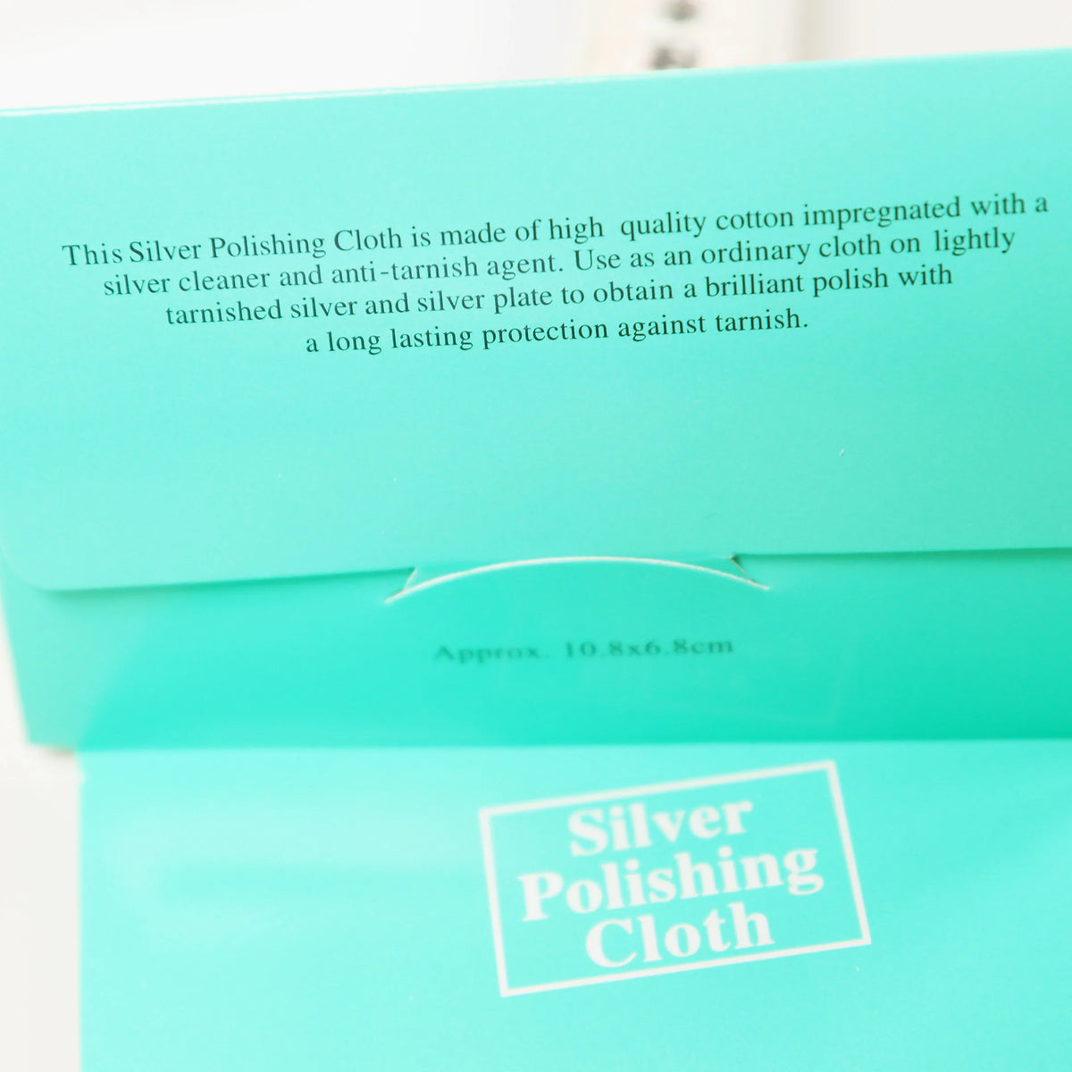 Mint green Peoni & Stone silver polishing cloth package with product information and white text labeling