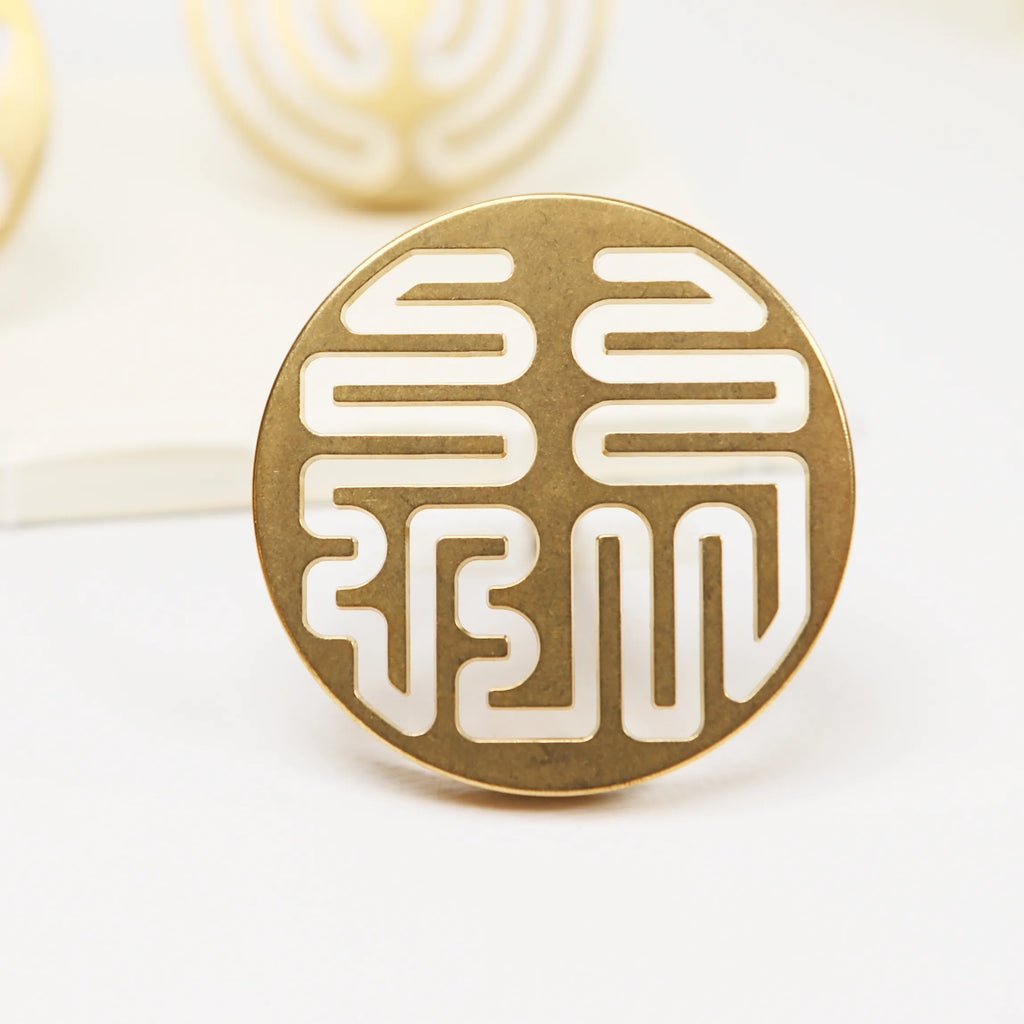 Circular brass seal with cut-out Lu prosperity symbol pattern in traditional Chinese design