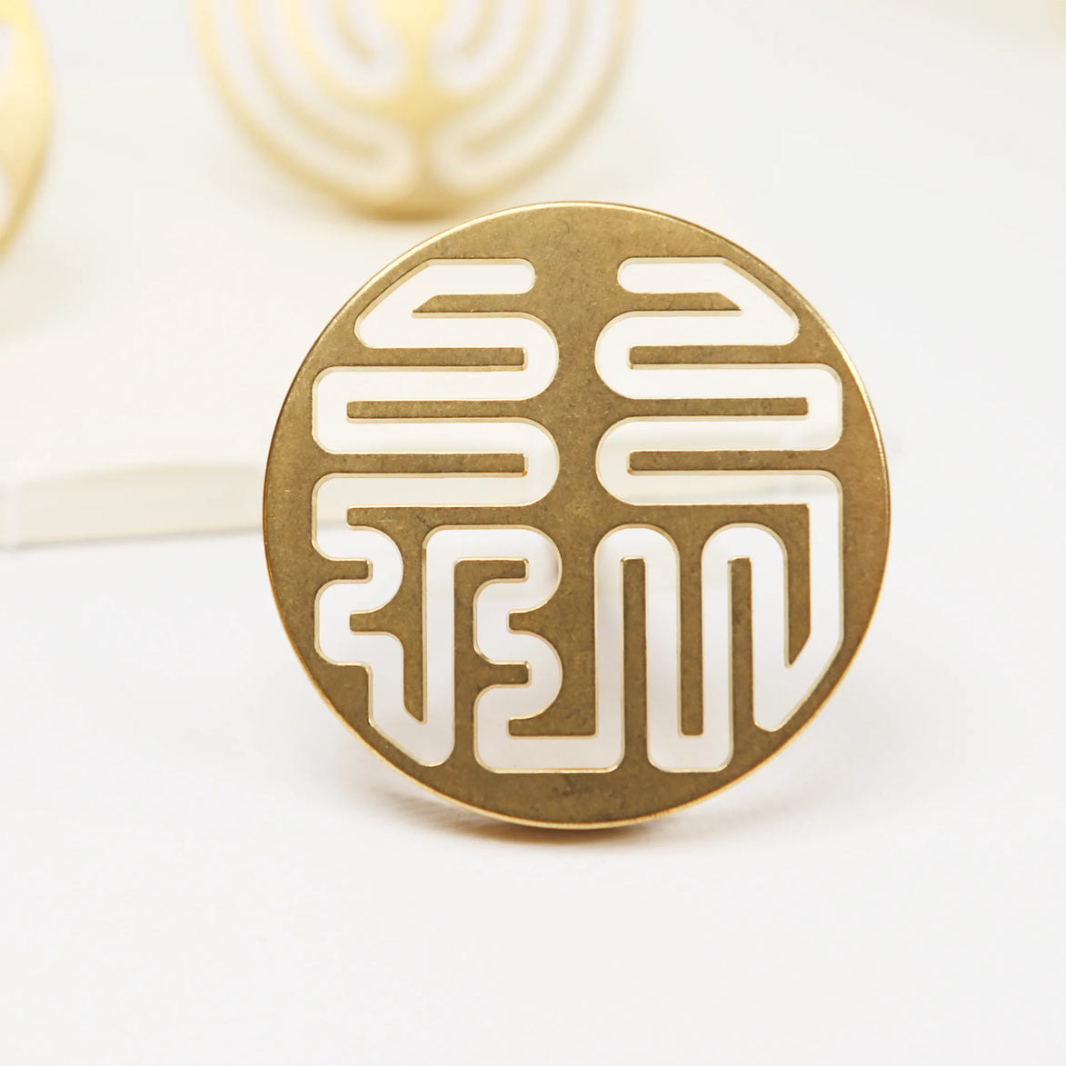 Circular brass seal with cut-out Lu prosperity symbol pattern in traditional Chinese design