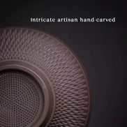 Hand-carved purple clay tea strainer with intricate geometric pattern detail