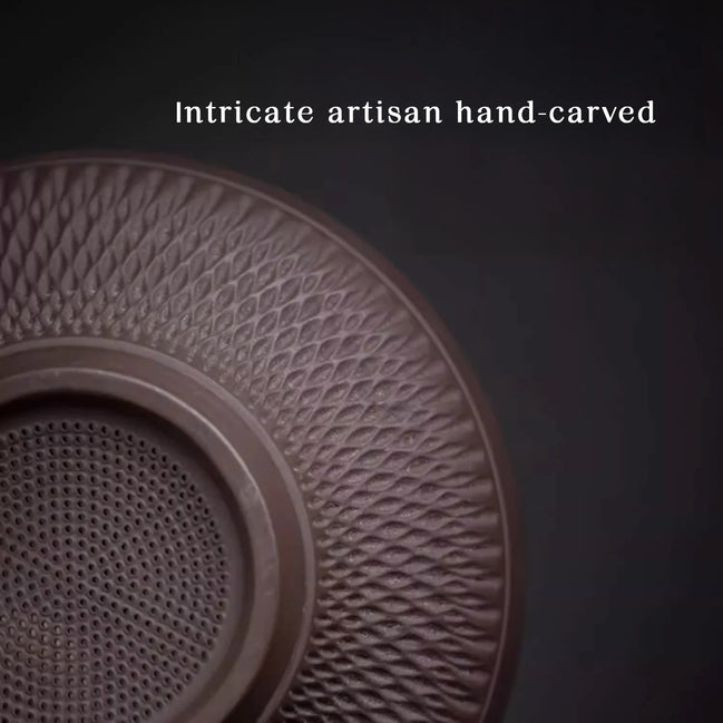 Hand-carved purple clay tea strainer with intricate geometric pattern detail